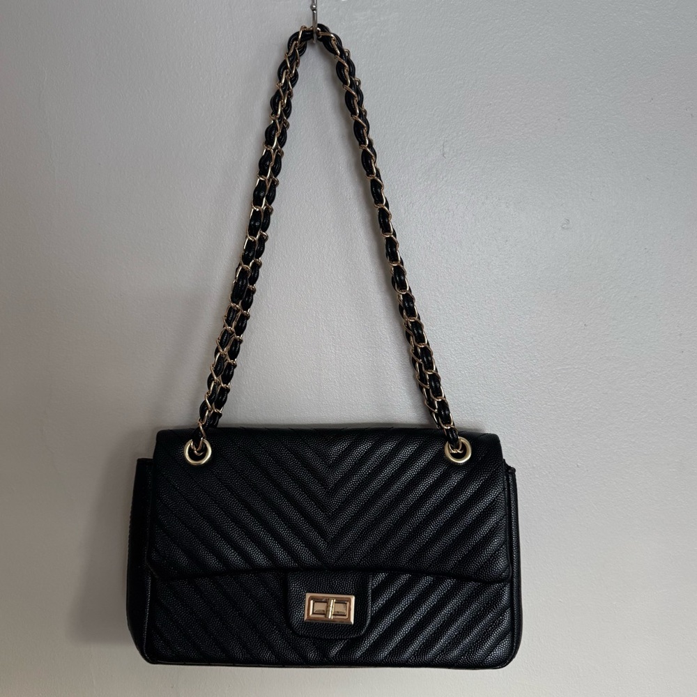 Black leather purse with gold hardware